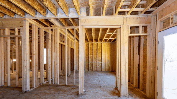 An image showing the interior frame of an American residential house under construction by valentynsemenov from Canva