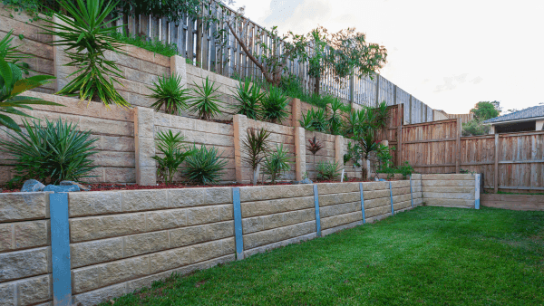 Multi level retaining walls with plants in the backyard by zstockphotos by Getty Images from Canva 